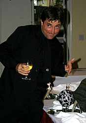 Eddie at the UH Arts Open reception pointin' at his egg